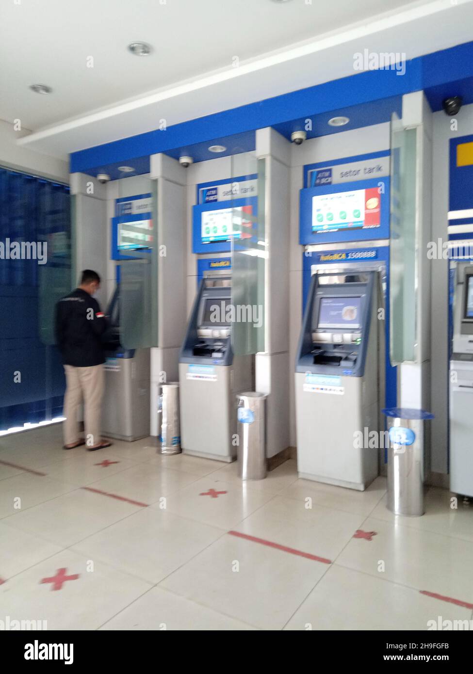 Editorial Photo, Indonesia, East Jakarta, 20 October 2021, Man make at financial transaction at ATM BCAf Stock Photo