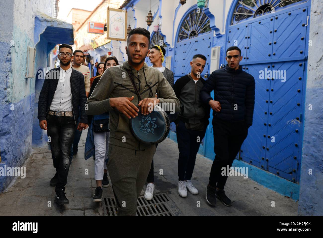 Moroccans walking through the medina of Chefchaouen, Morocco. Stock Photo