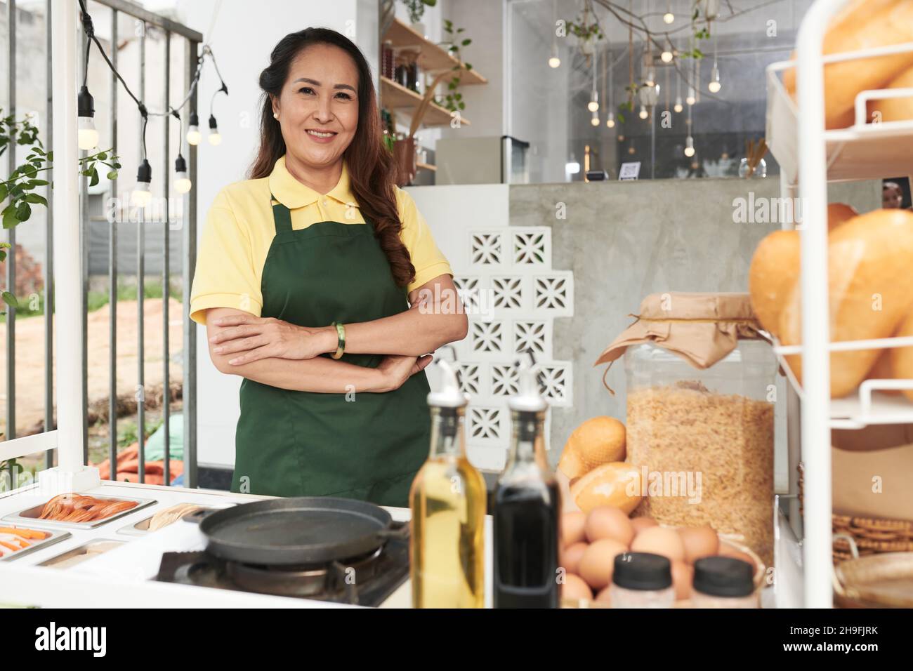 Cheerful mature woman green hi-res stock photography and images - Alamy