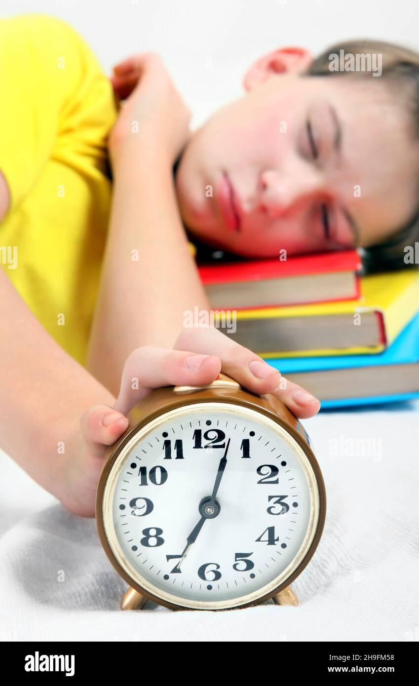 Child asleep bed clock hires stock photography and images Alamy