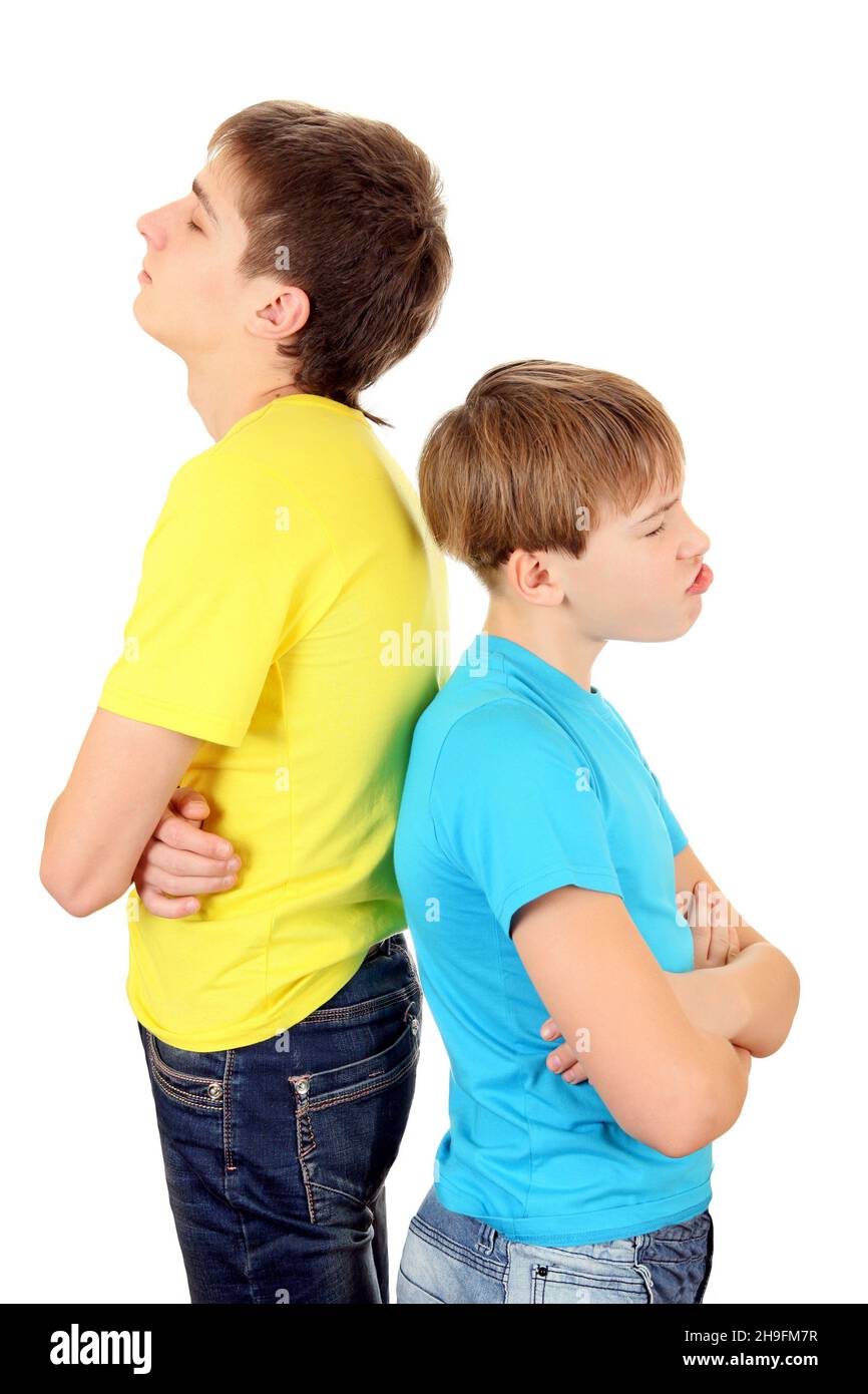 Brothers in Conflict stand Back to the Back on the White Background Stock Photo