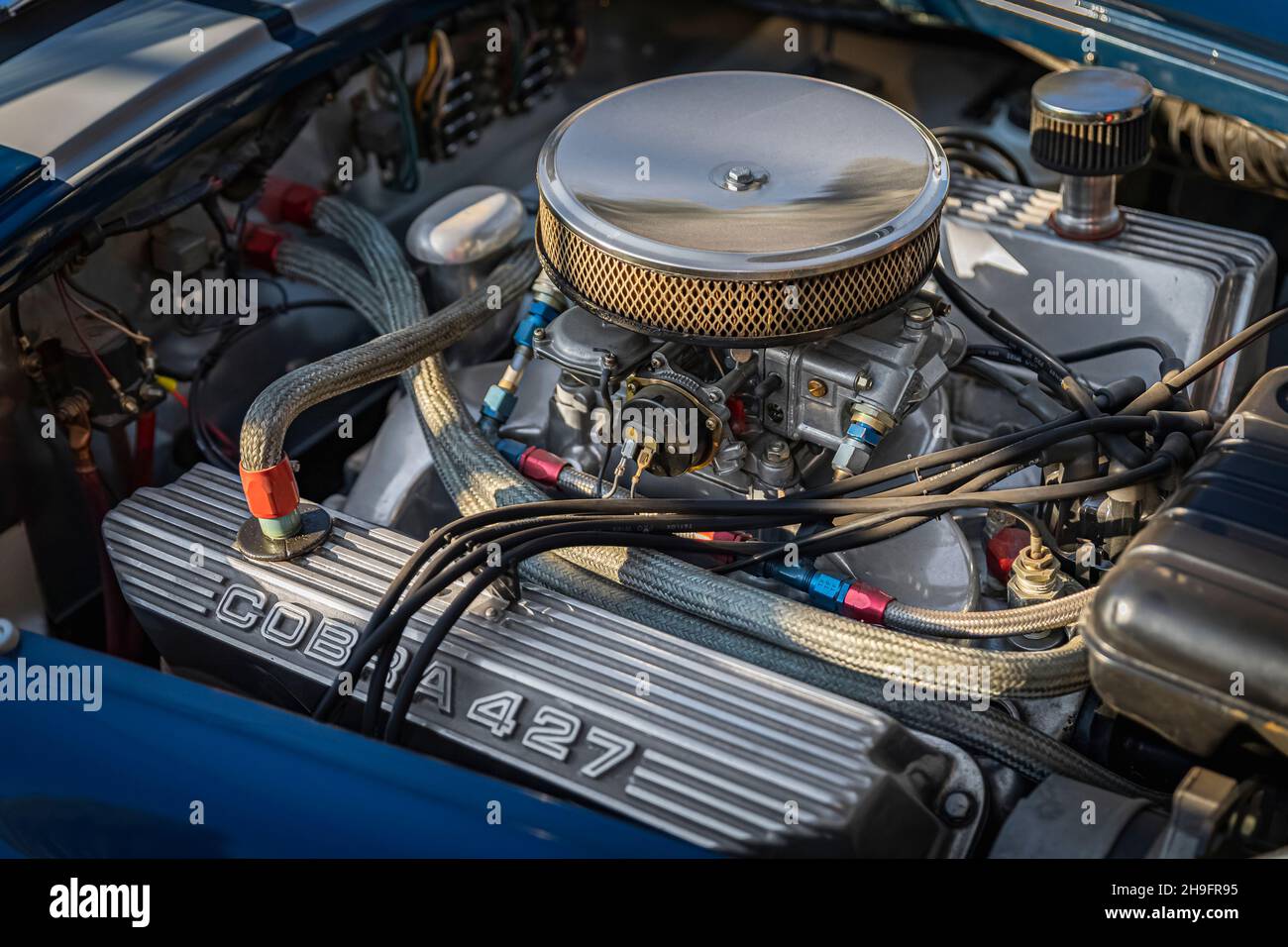 Placerville, USA - November 25, 2020: Open hood and engine of a classic rare vintage American muscle car blue 1967 Ford Shelby Cobra 427 Stock Photo