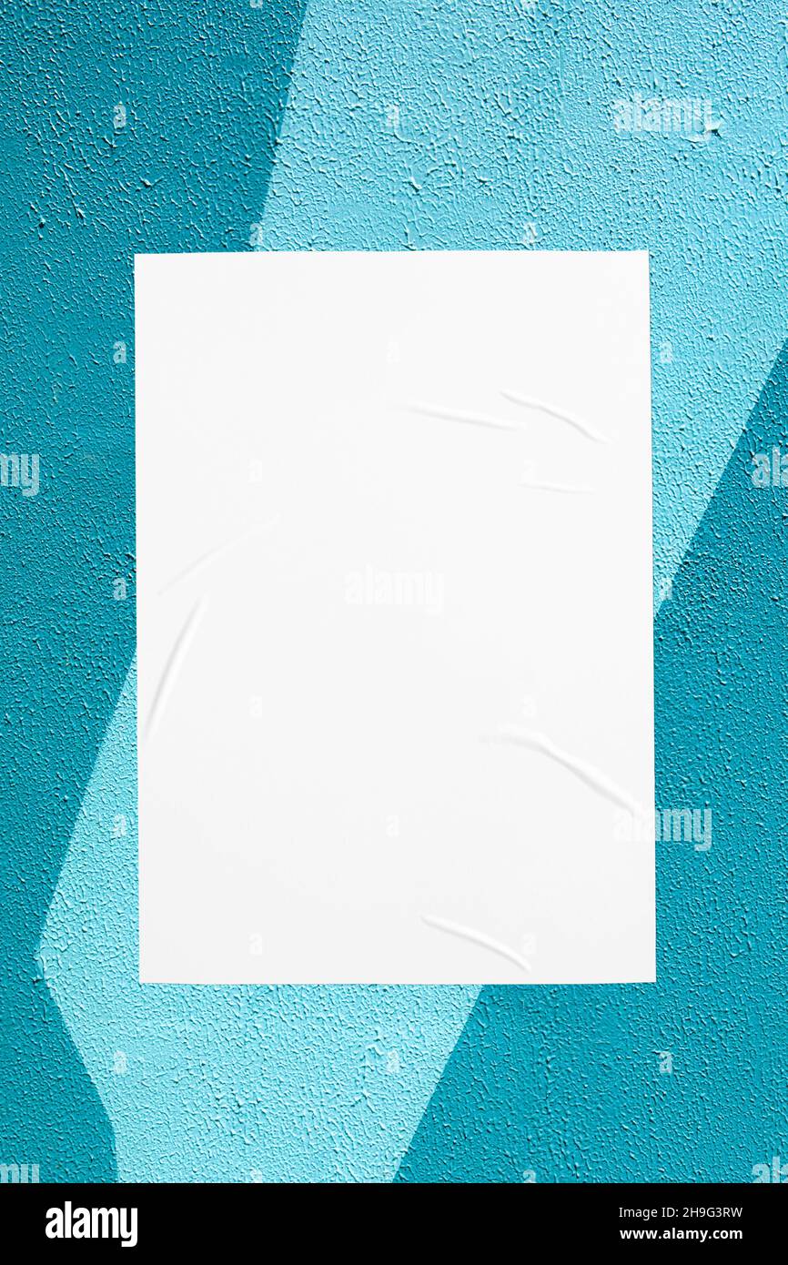 teal mint urban wall with glued poster Stock Photo