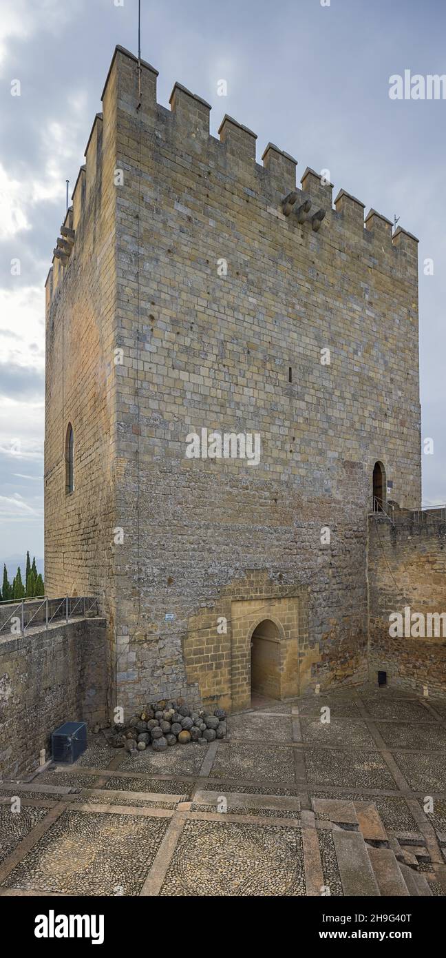 Vertical panorama of the Tower of Tribute, the Torre del Homenaje, in the La Mota fortress, a large walled enclosure above Alcala la Real Stock Photo