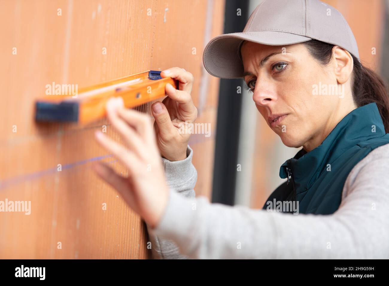 attractive young female construction worker Stock Photo