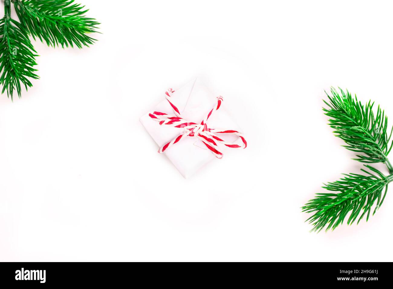 Christmas holiday composition gift box with spruce branch on a white ...
