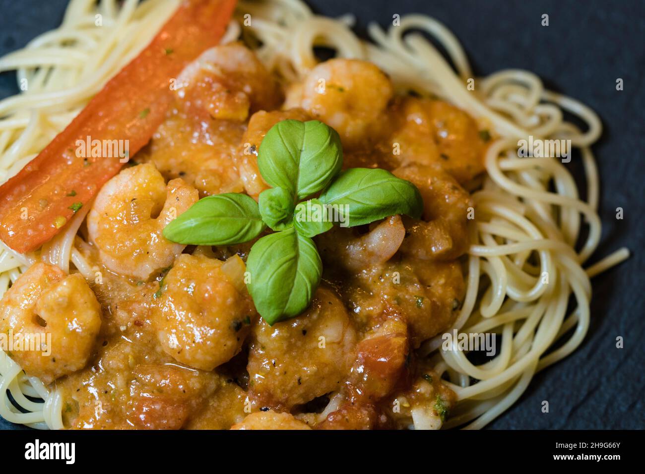 Spaghetti alla busara pasta with shrimps an Italien specialty Stock