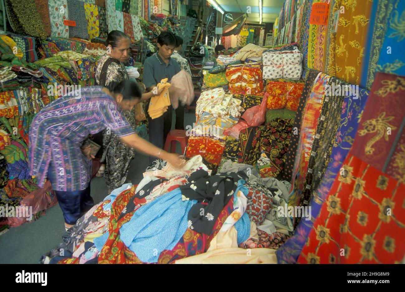 a Batik Textile painting and production in a Factory in the city of Kuala Lumpur in Malaysia.  Malaysia, Kuala Lumpur, August, 1997 Stock Photo