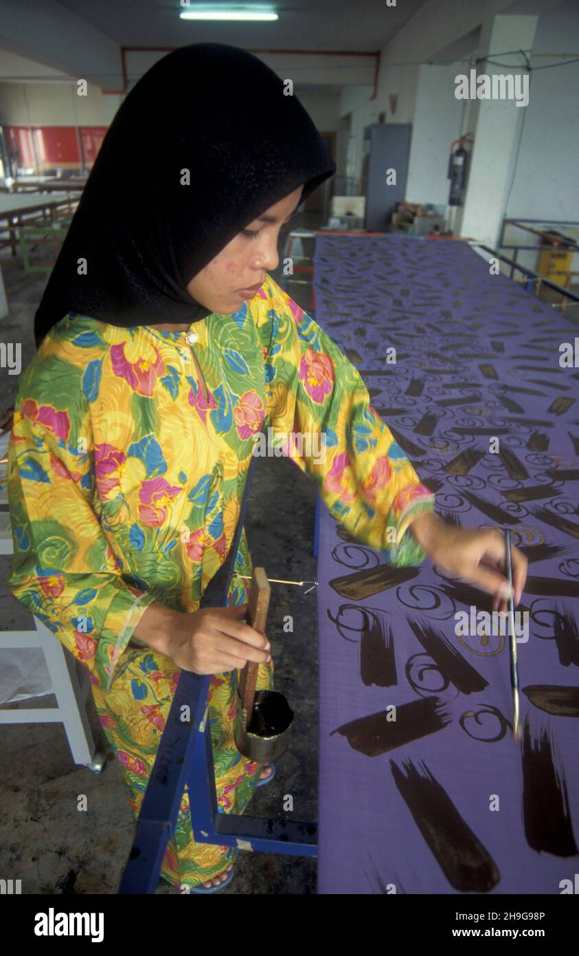 a Batik Textile painting and production in a Factory in the city of Kuala Lumpur in Malaysia.  Malaysia, Kuala Lumpur, August, 1997 Stock Photo