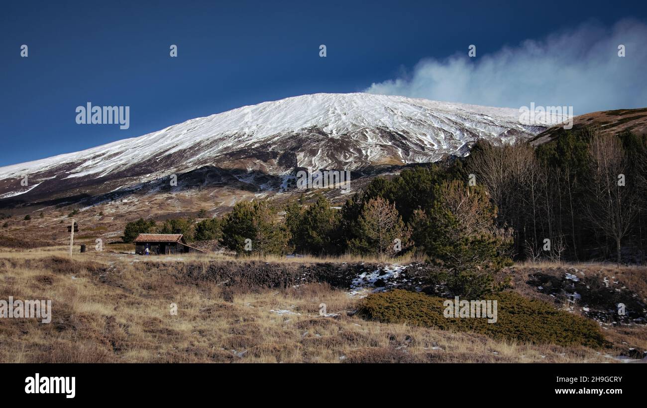 winter view south-west slopes of Etna Mountain in Sicily above stone house refuge of 'Poggio La Caccia' Stock Photo
