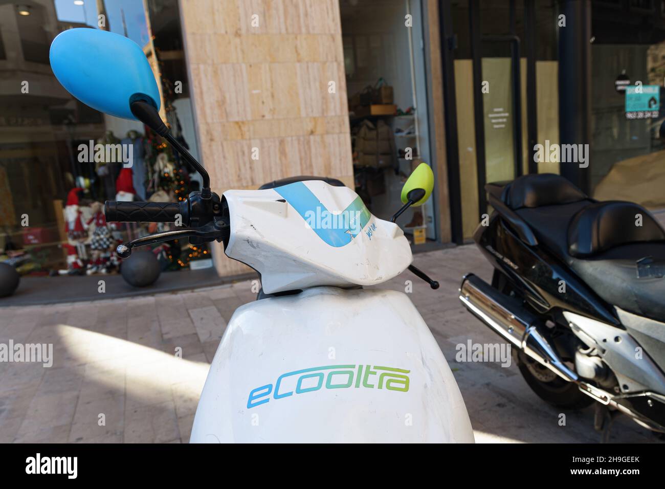 VALENCIA, SPAIN - DECEMBER 05, 2021: Electric motorcycle sharing system. eCooltra company Stock Photo