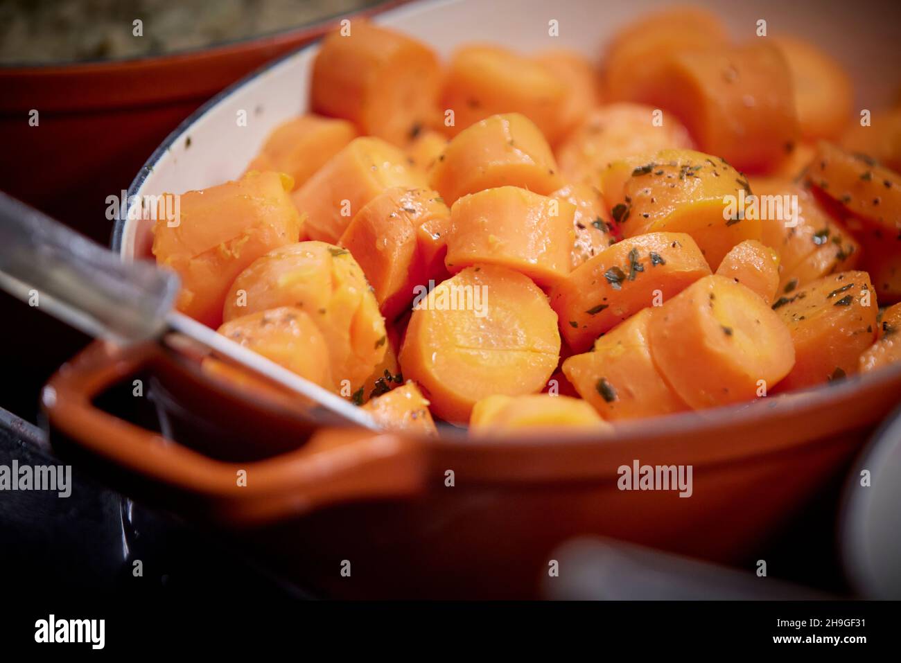 Pub carvery self service cooking pot of carrots Stock Photo