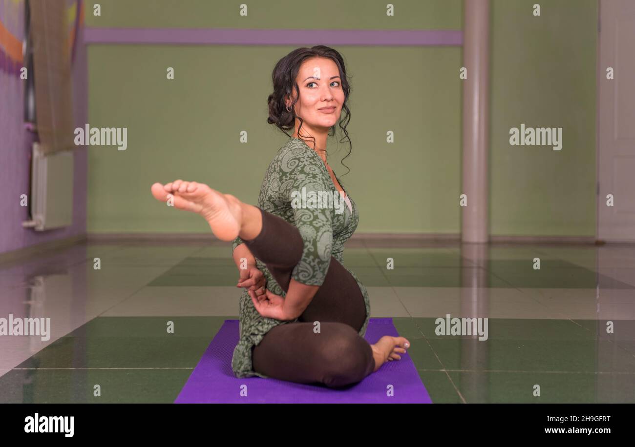 Young yogi woman stretching hi-res stock photography and images - Alamy