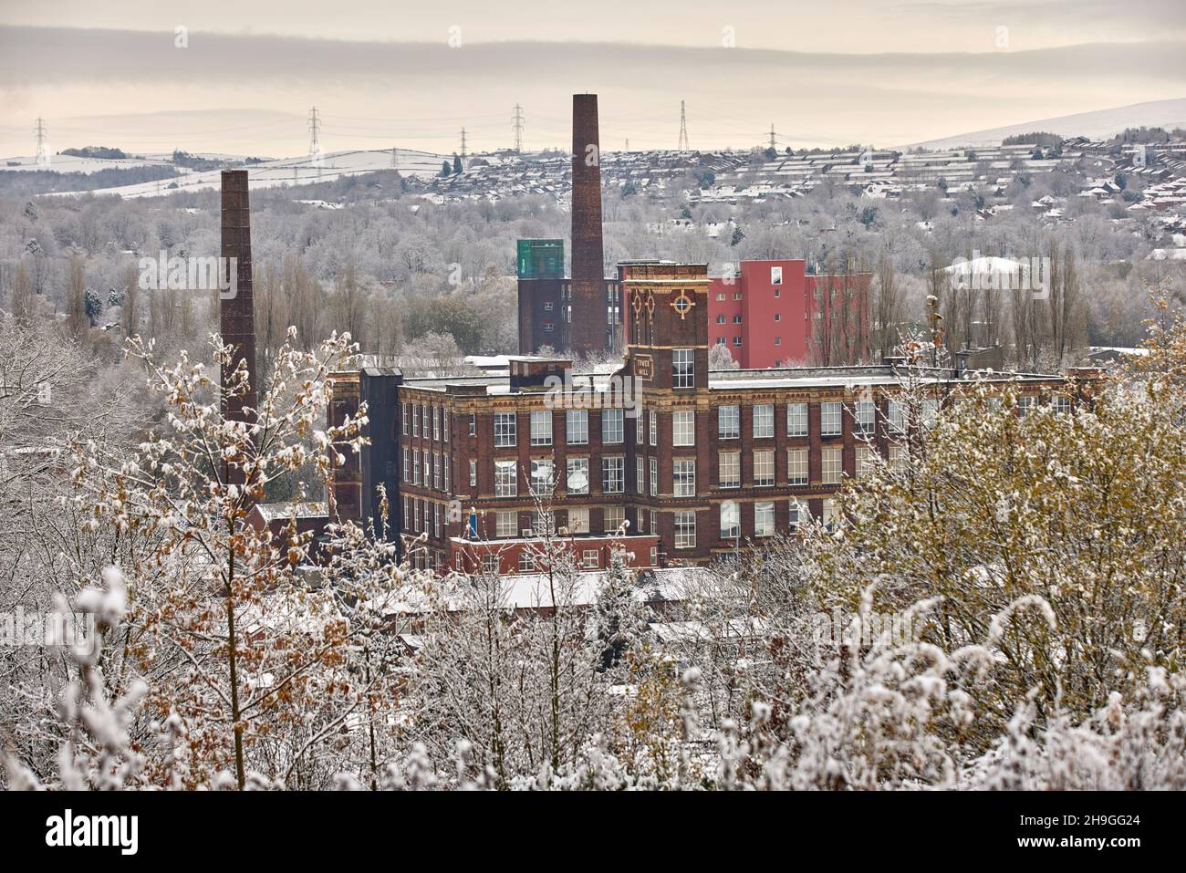 Tameside Winter Snow, Dukinfield, Greater Manchester, England. Grade II listed Tower Mill former cotton mill designed by Potts, Pickup & Dixon in 1885 Stock Photo