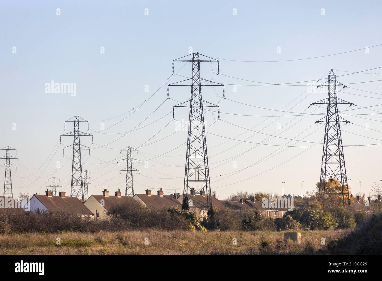 Electricity pylons supplying houses in Dartford Kent UK Stock Photo