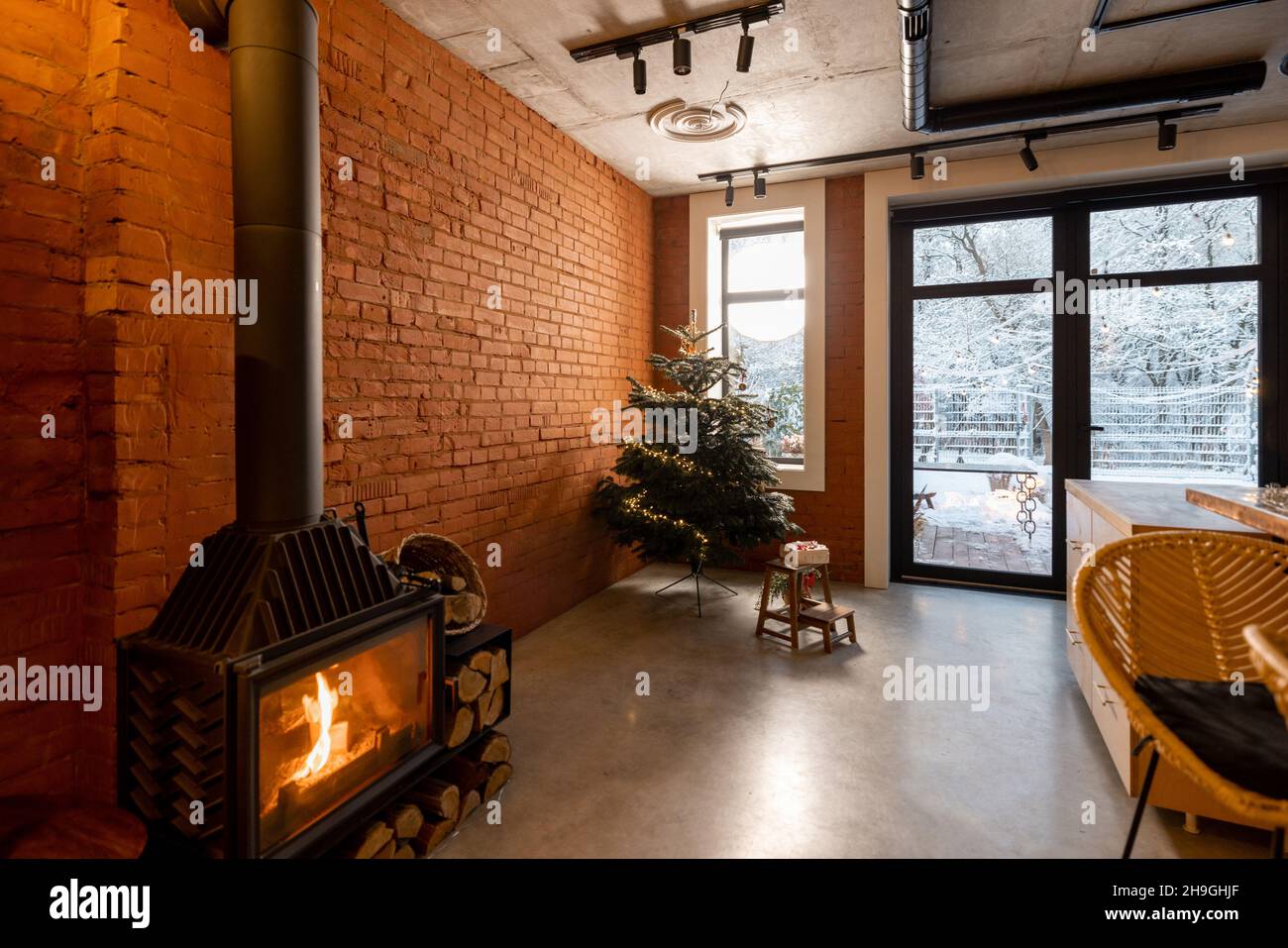 Cozy living room interior with Christmas tree and fireplace Stock Photo ...