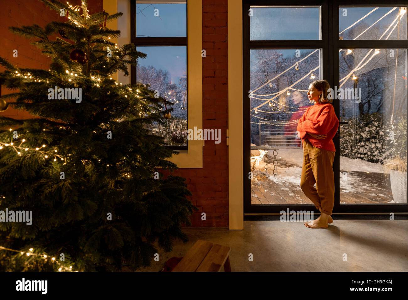 Cozy living room interior with Christmas tree and fireplace Stock Photo ...