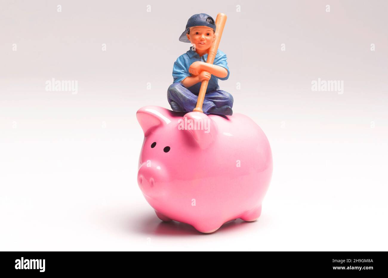 Young Boy with Piggy Bank Savings Stock Photo