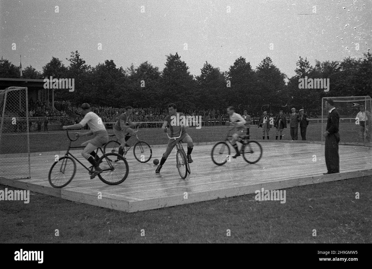 Wroc³aw, 1948-06-28. VI etap (Poznañ – Wroc³aw) VII Wyœcigu Kolarskiego Tour de Pologne. Na Stadionie Olimpijskim odby³y siê pokazy ró¿nych dyscyplin sportów rowerowych. Nz. mecz pi³ki rowerowej. uu  PAP    Wroclaw, June 28, 1948. The 6th stage (Poznan – Wroclaw) of the 7th Tour de Pologne cycling race. A variety of bicycle disciplines was shown on the Olympic Stadium. Pictured: a bicycle ball match.  uu  PAP Stock Photo