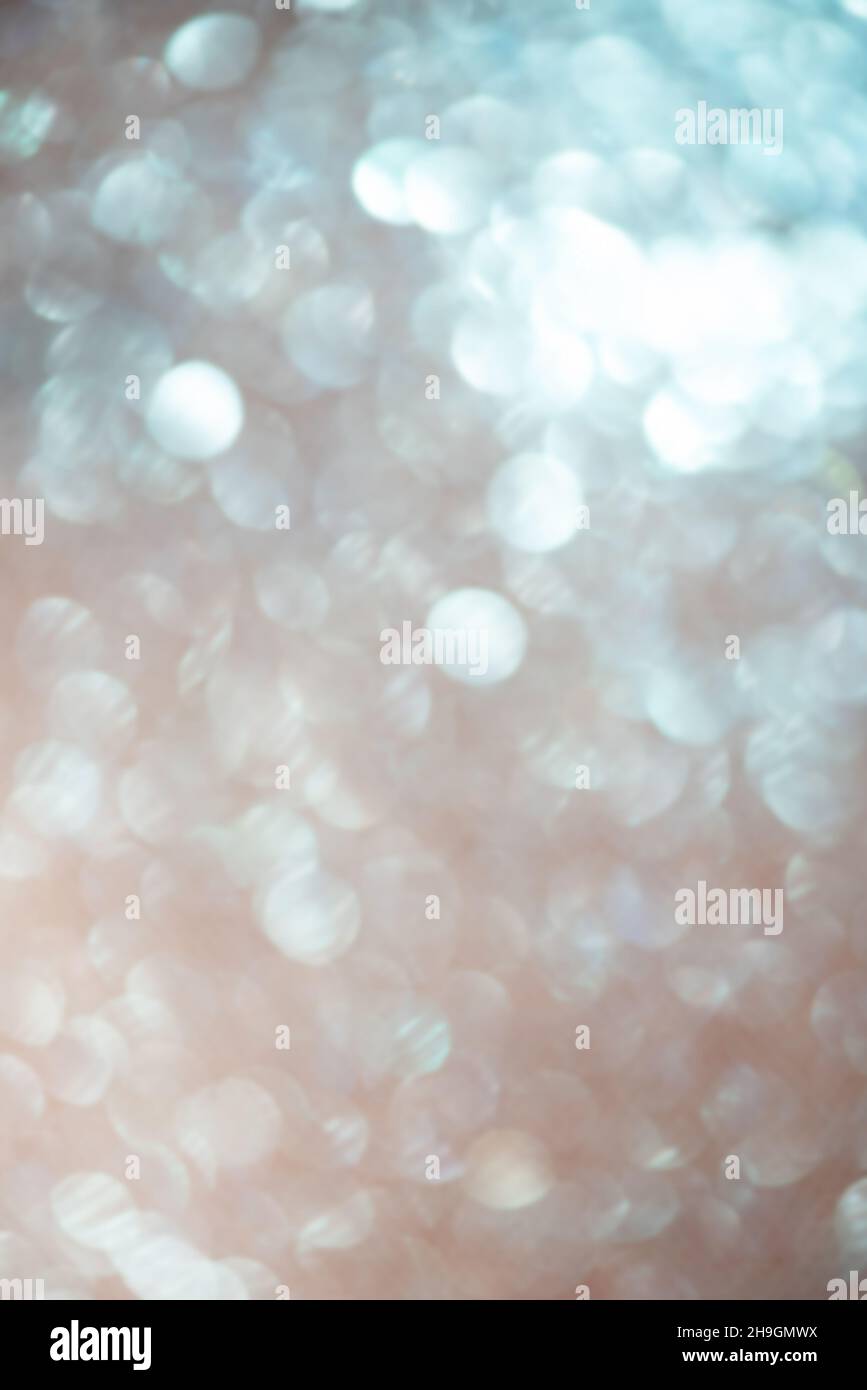 Defocus light blue glitter. Gradient transition from blue to beige abstract background. Stock Photo