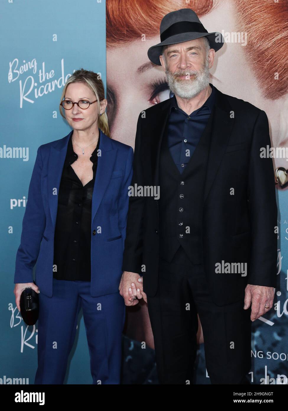 LOS ANGELES, CALIFORNIA, USA - DECEMBER 06: Actress Michelle Schumacher and  husband/actor J.K. Simmons arrive at the Los Angeles Premiere Of Amazon  Studios' 'Being The Ricardos' held at the Academy Museum of