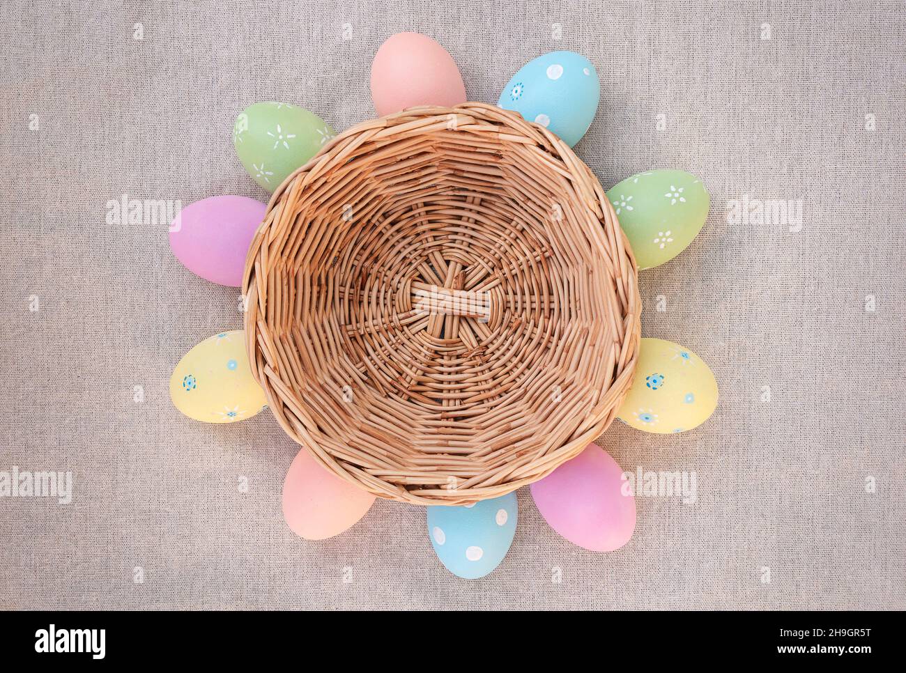 Basket with Easter eggs. Easter eggs lie around the basket Stock Photo
