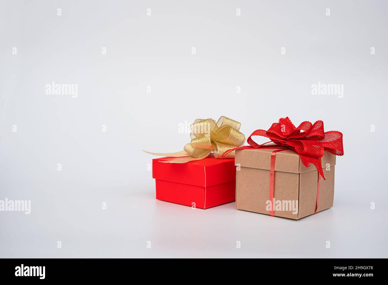 two gift boxes with bows on a white background Stock Photo