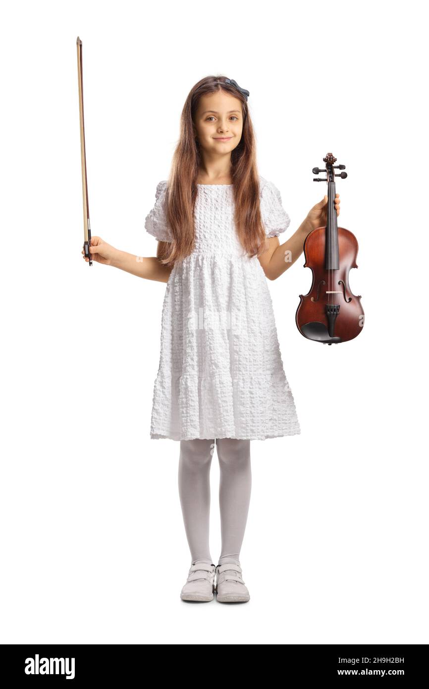 Full length portrait of a girl in a white dress holding a violin ...
