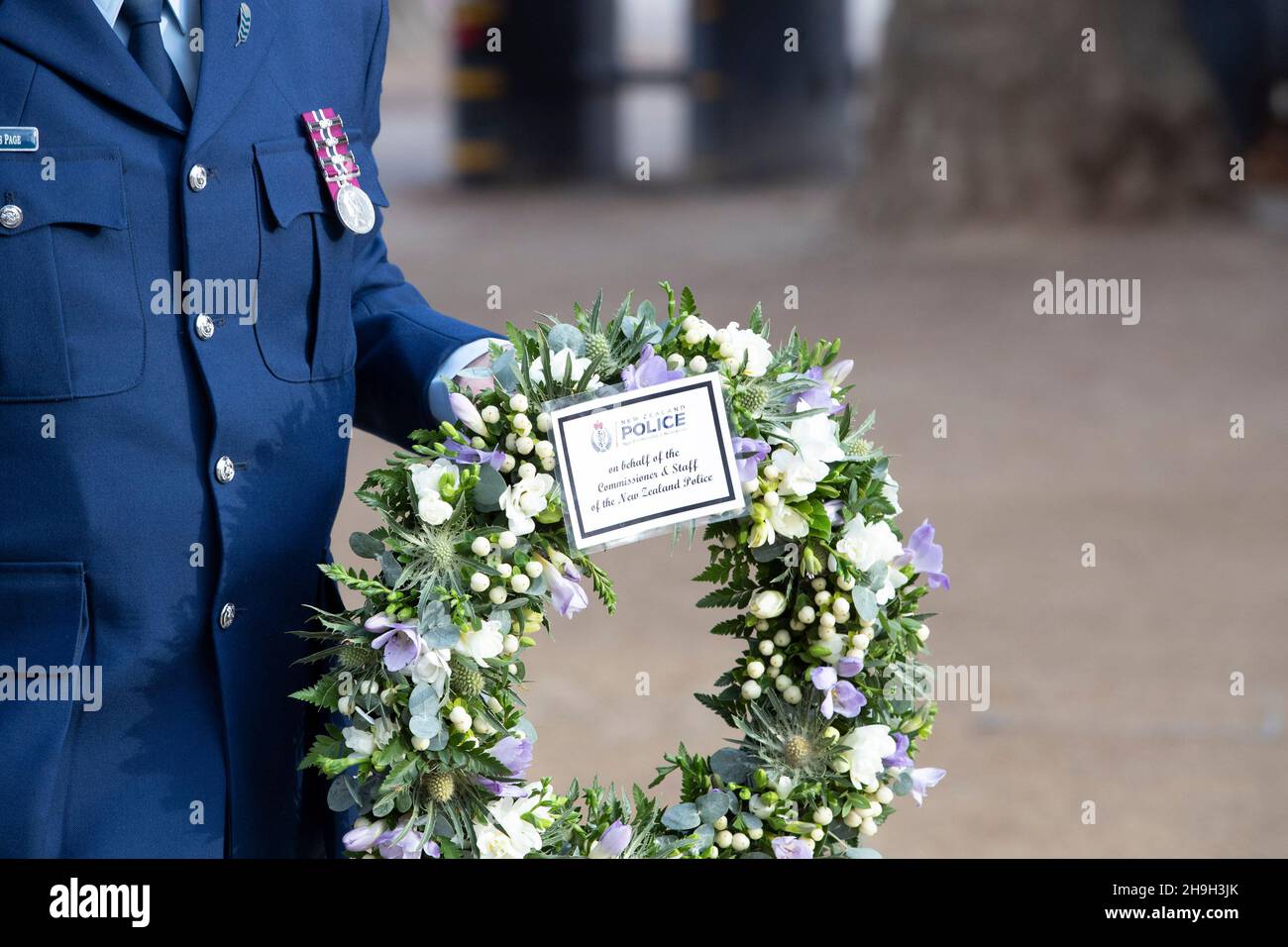 New Zealand Police Detective Superintendent Chris Page attends Murdered Police Officer Sgt Matt Ratana's memorial in Central London with a wreath Stock Photo