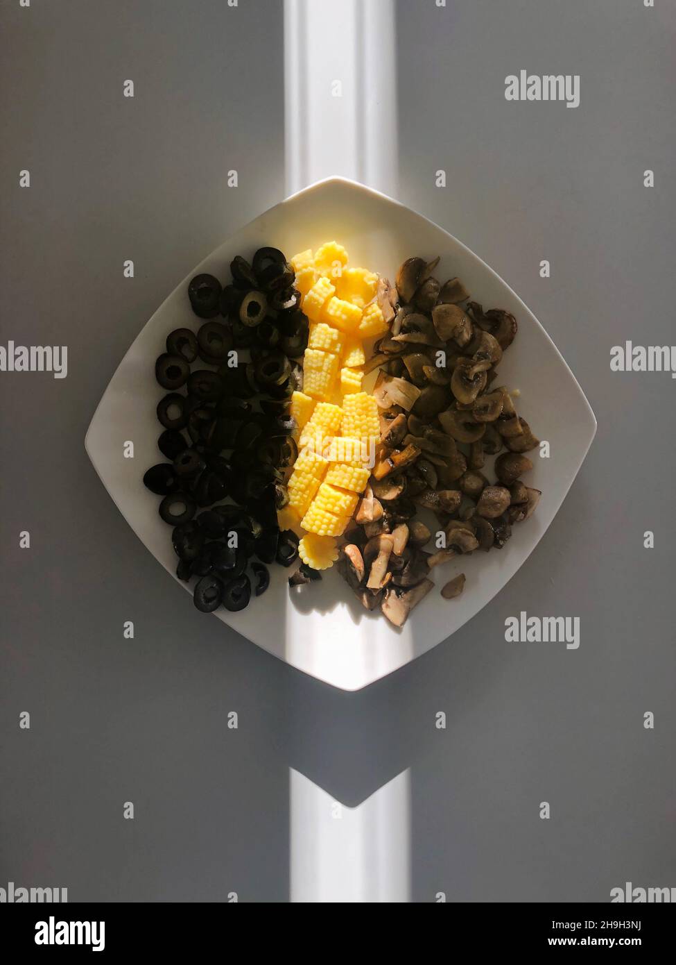 Ingredients black olives, corn, champignons Stock Photo Alamy