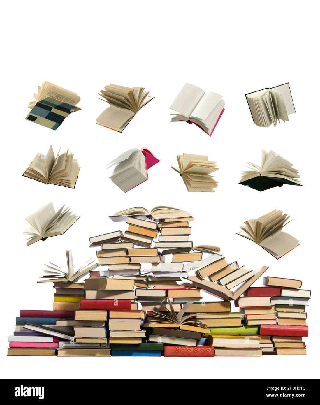 Books falling on a large pile of books on a white background. Stock Photo