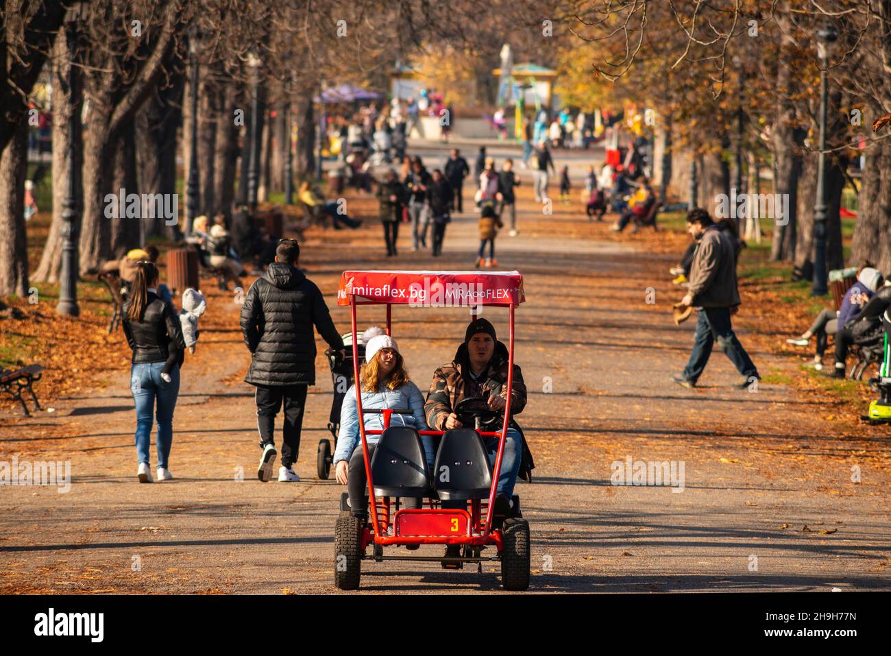 People walking in park on beautiful Autumn day in Sofia, Bulgaria Stock Photo