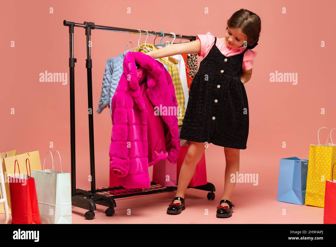 Little Child Girl Posing Hangers Dresses Clothes Her Room Kid Stock Photo  by ©jutar 497845202