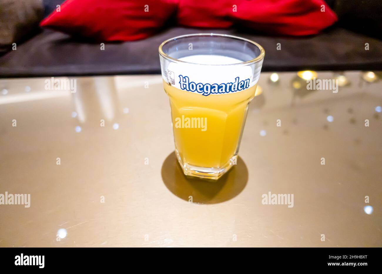0.3 litres glass of Hoegaarden on a table. Wheat Belgium beer spiced