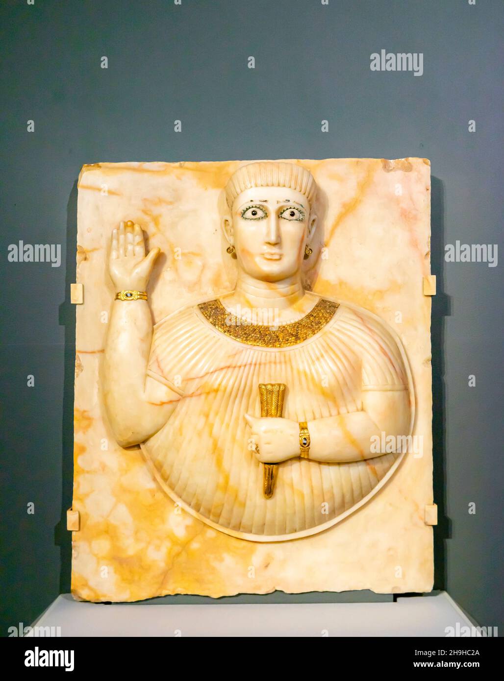 Stele depicting woman with sheaf of wheat, Qataban, South Arabia, c 100. Arabian Stele made of alabaster, gold, bronze, from Al Thani Collection Stock Photo