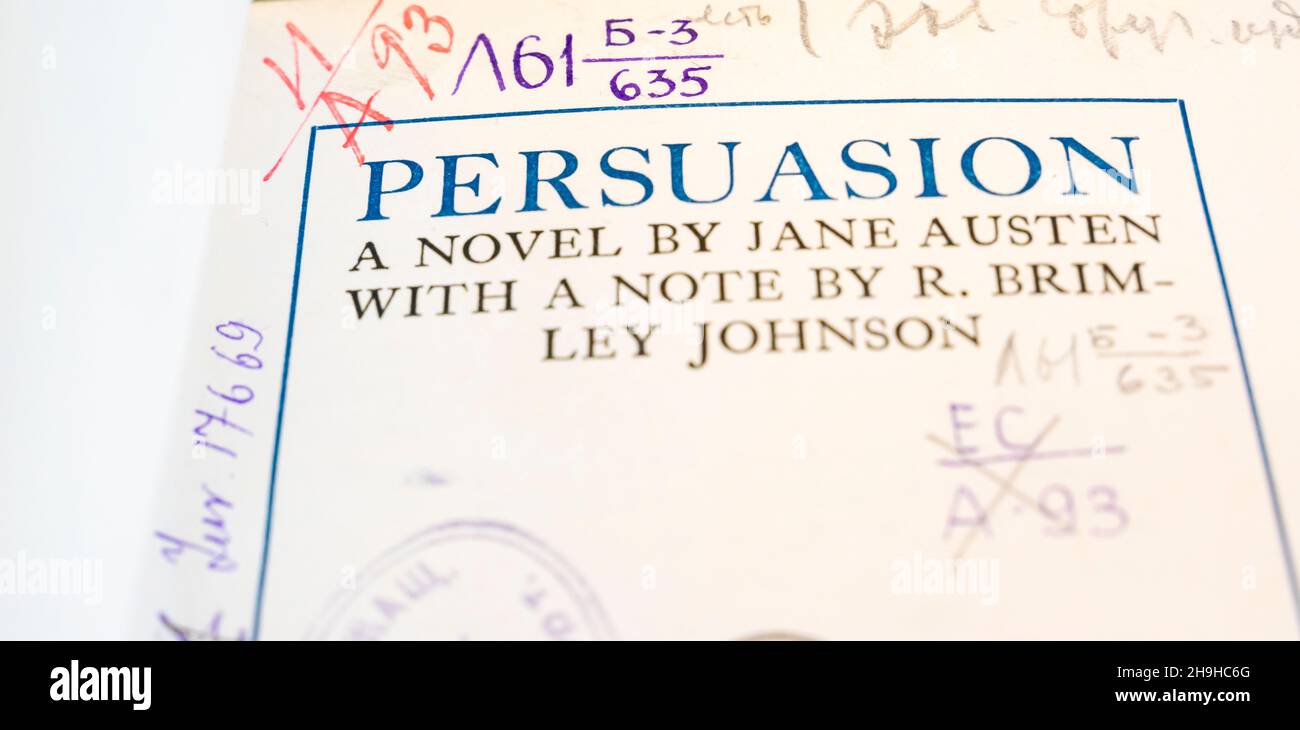 Title page of Jane Austen's 'Persuasion' covered with a lot of library stamps. The novel persuasion is to be adapted into motion picture in 2022. Stock Photo
