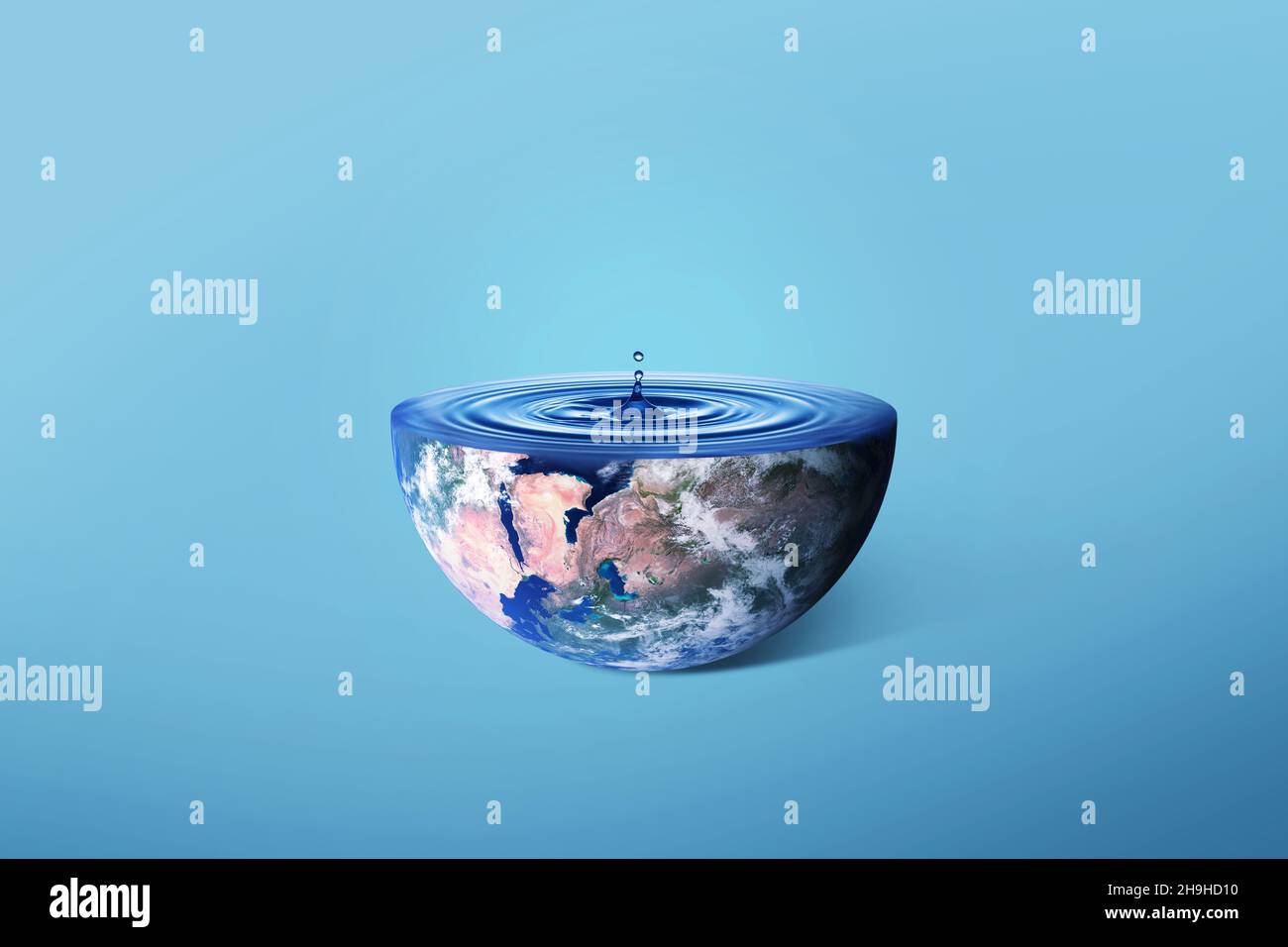 Planet Earth with blue water waves and drop, creative concept. Half of ...