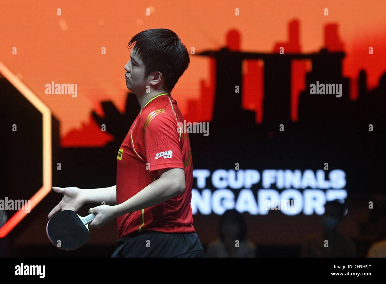 Singapore. 7th Dec, 2021. Fan Zhendong reacts during the men's singles