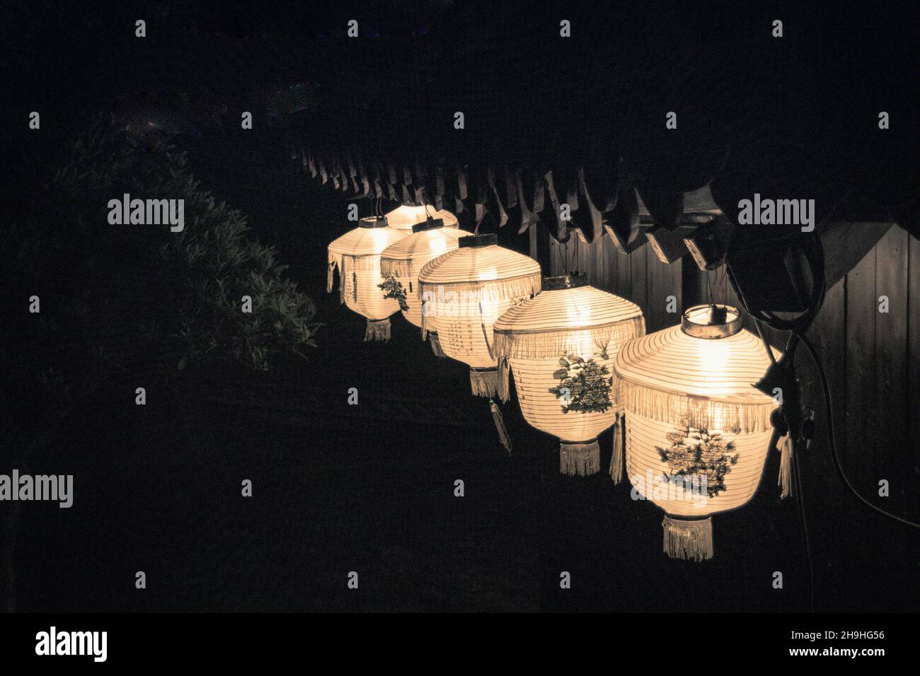 Closeup of the glowing paper lanterns. Illuminated streets at Lantern Festival. Okinawa, Japan. Stock Photo