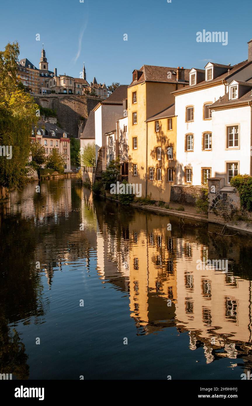 View of the old, historic town of Luxembourg City by the Alzette river in Grund Valley. Stock Photo