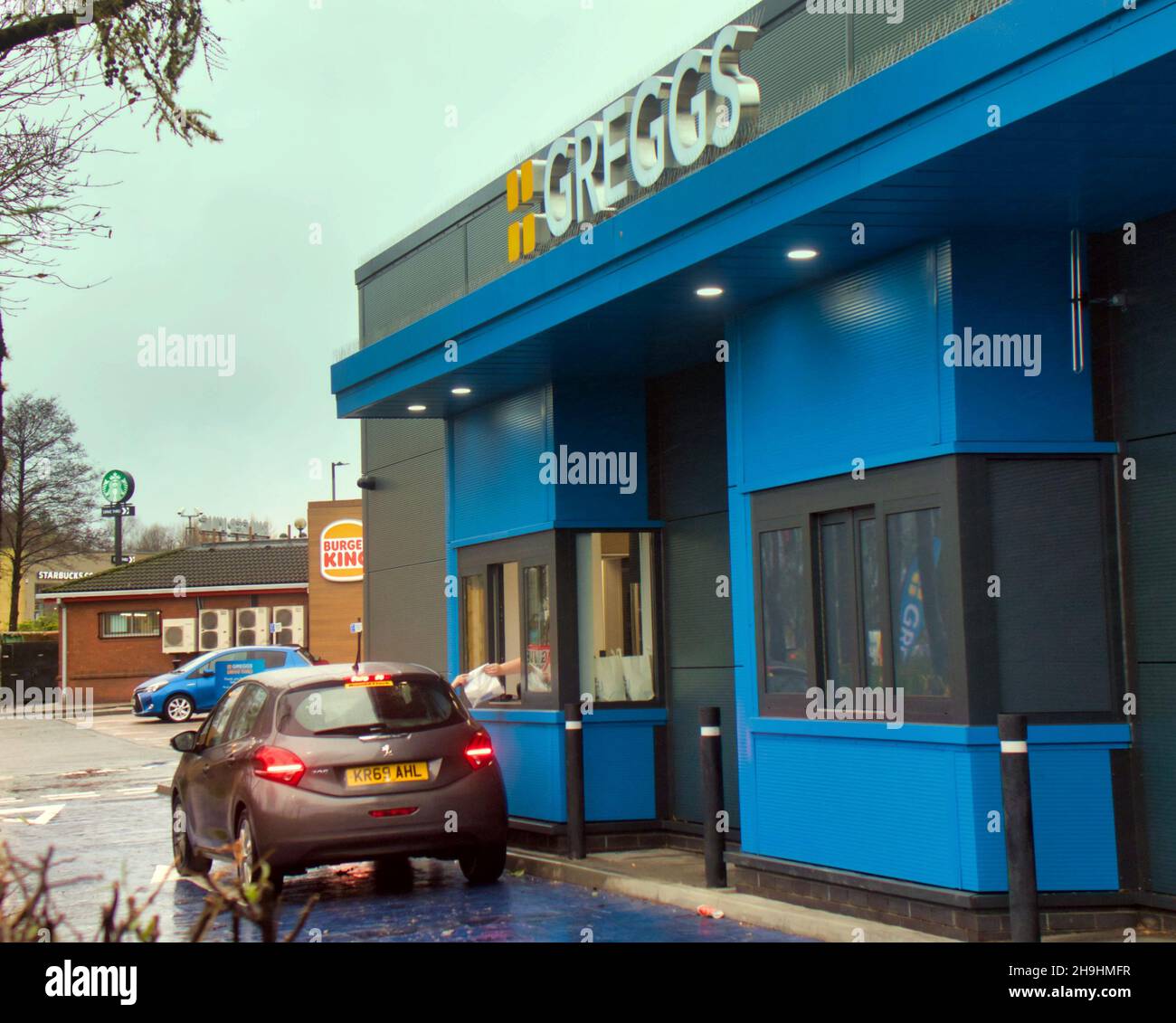 Glasgow, Scotland, UK  7th  December, 2021.  First greggs drive thru opens in great western retail park today with its target market of the council estate of drumchapel as its base.. Credit  Gerard Ferry/Alamy Live News Stock Photo