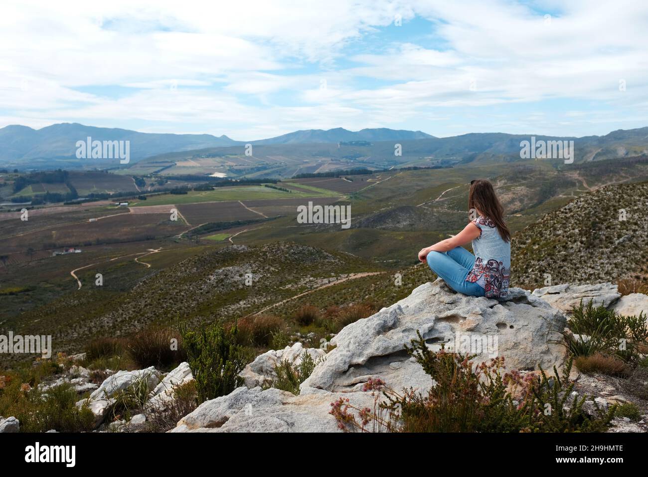Female hiker sitting on rock hi-res stock photography and images - Alamy