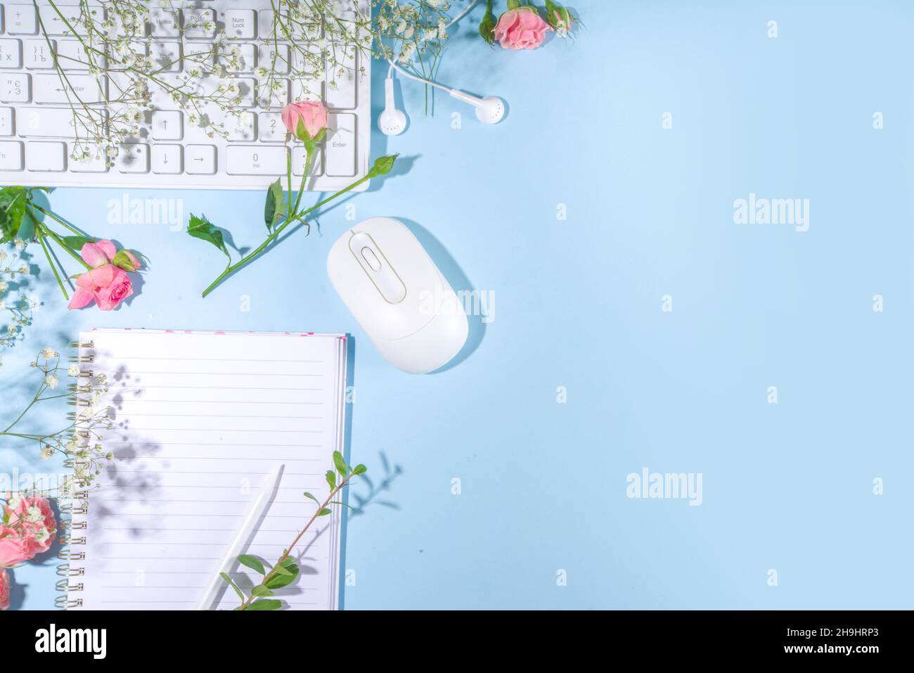 Spring office desk flatlay with keyboard, notepad, tablet, mouse ...