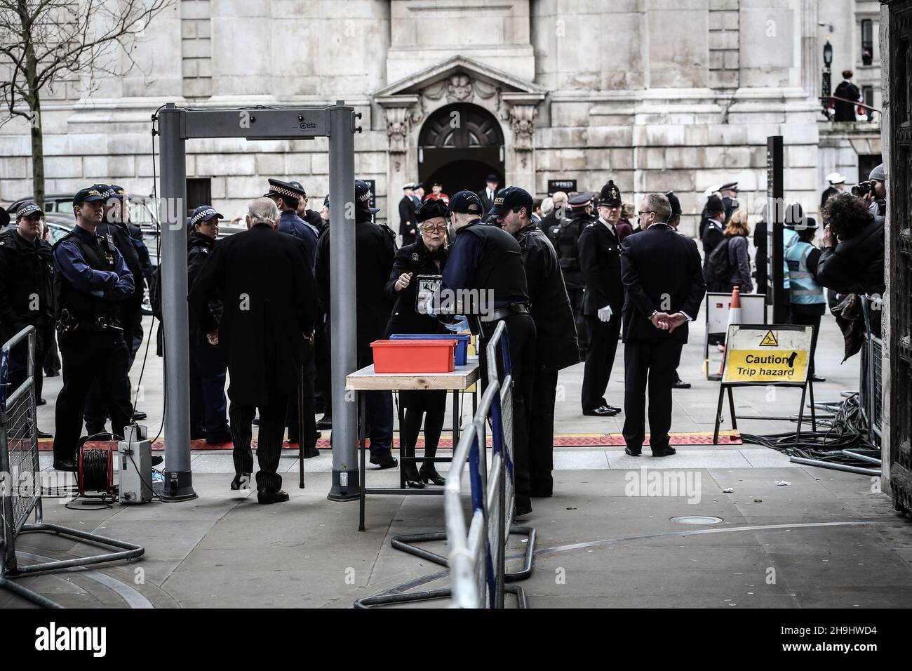 Police search bags prior to the funeral of Baroness Thatcher at St Paul's Cathedral in London.  Stock Photo