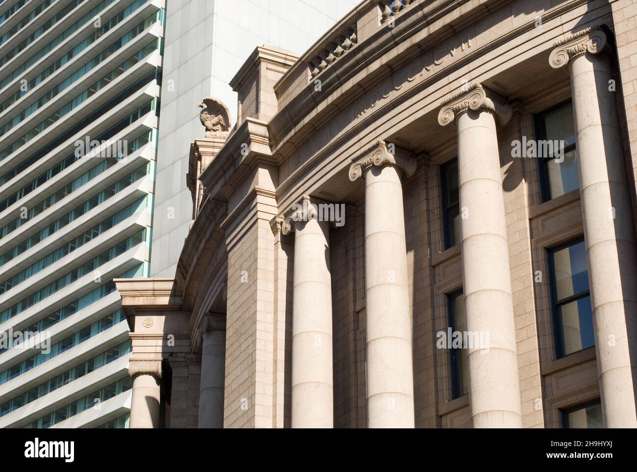 South Station detail set against the back drop of the Federal Reserve Building. Stock Photo