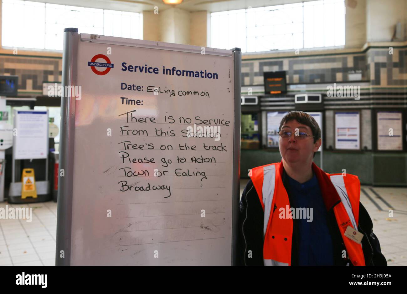 Claire of the London Underground at the Ealing Common tube station explains the reason for the closure of the station Stock Photo