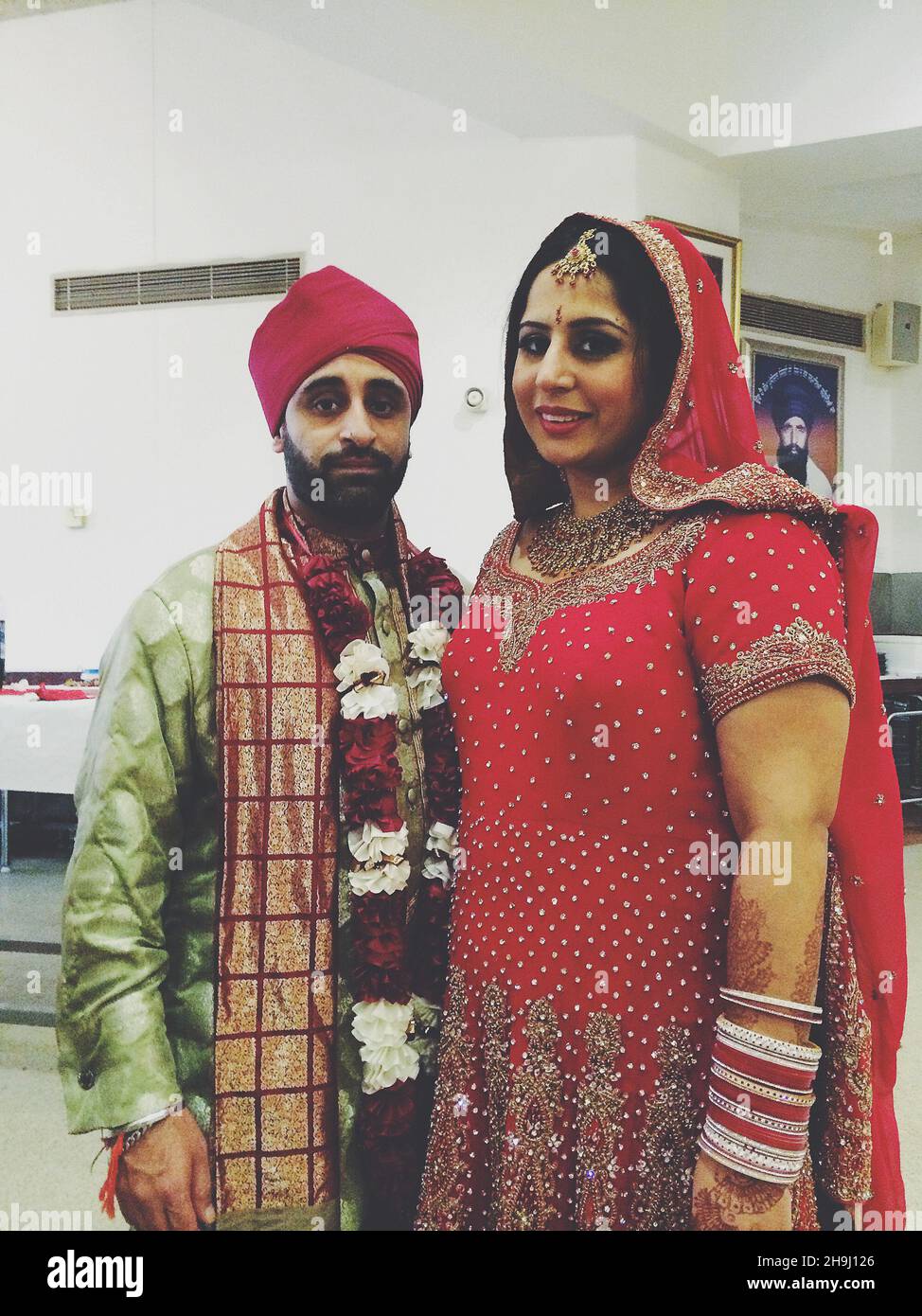 A newly wed couple at Southall Hindu Temple (part of a series of images taken and processed on the iPhone by winner of the Terry O'Neill award mobile category, Richard Gray) Stock Photo