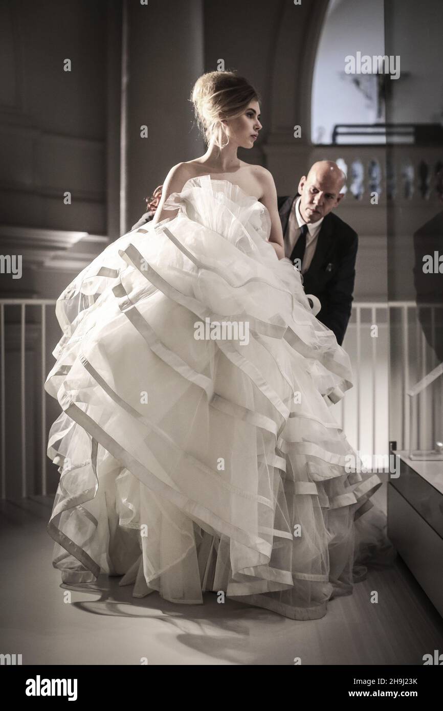 Model Jenny Bishop and bridal dress designer Ian Stuart before the opening of Wedding Dresses 1775-2014 at the Victoria and Albert Museum, London. She is modelling one of his dresses, a theatrical