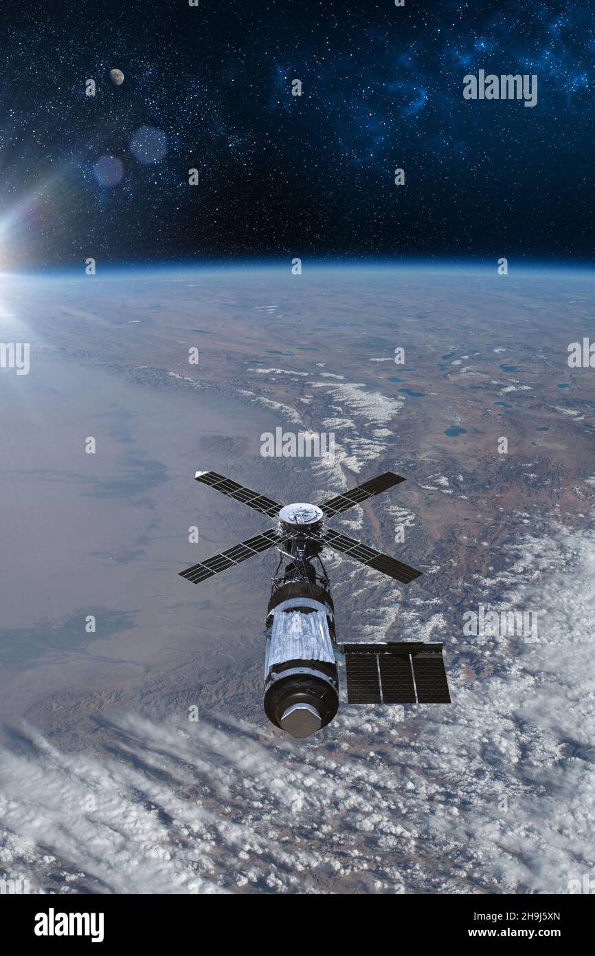 Cargo space craft and Earth planet. Dark background. Sci-fi wallpaper.Space Station Orbiting Earth.Space ship. Space art wallpaper.Solar Observatory.E Stock Photo