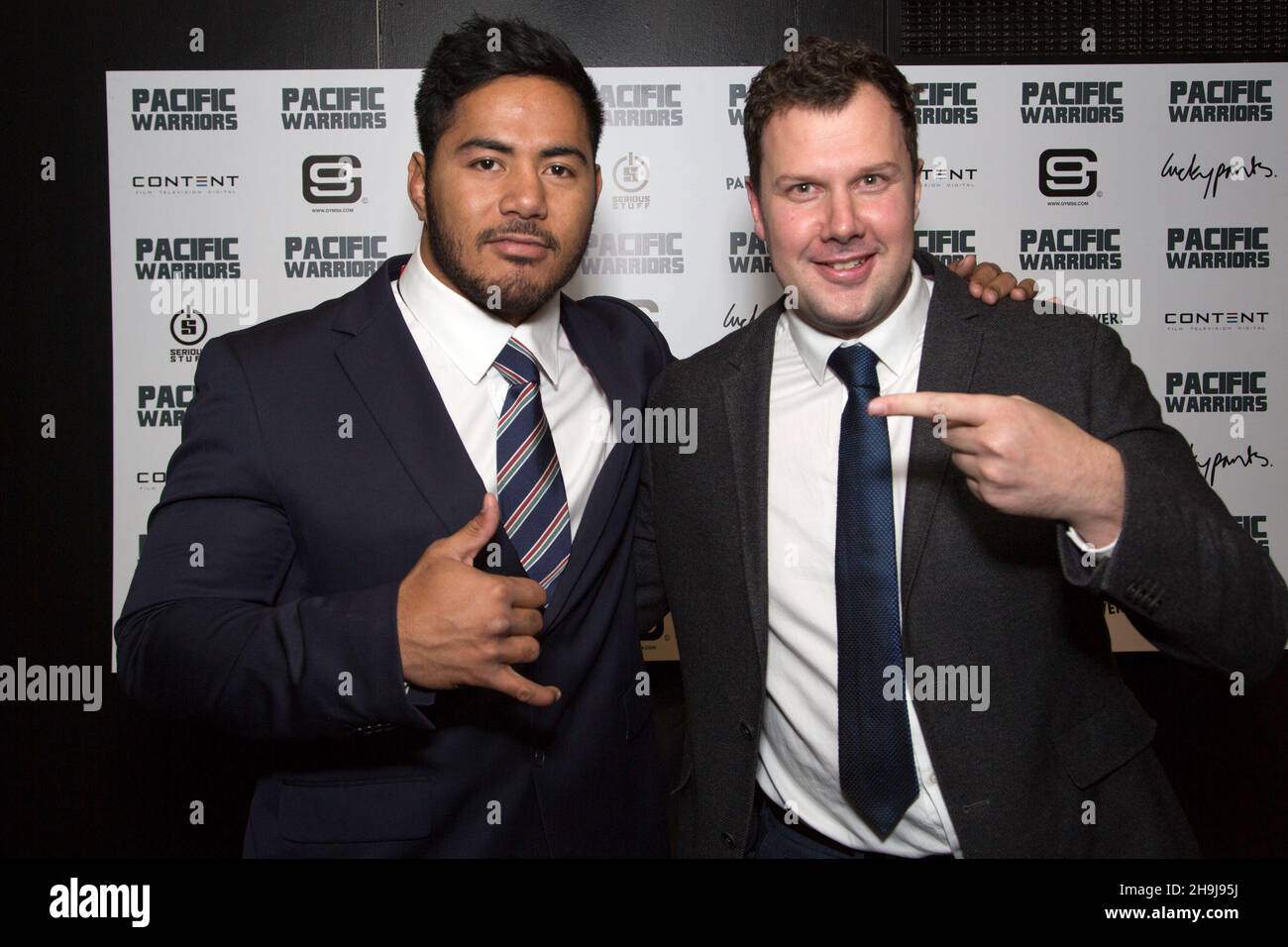 Manu Tuilagi (left) and Adam Perrin (director) pose for photos as former and current players from the world of rubgy arrive at the Curzon Cinema in London's Shaftesbury Avenue to attend the opening night of Pacific Warriors, about the culture of rugby in Somao and Tonga by director Adam Perrin Stock Photo